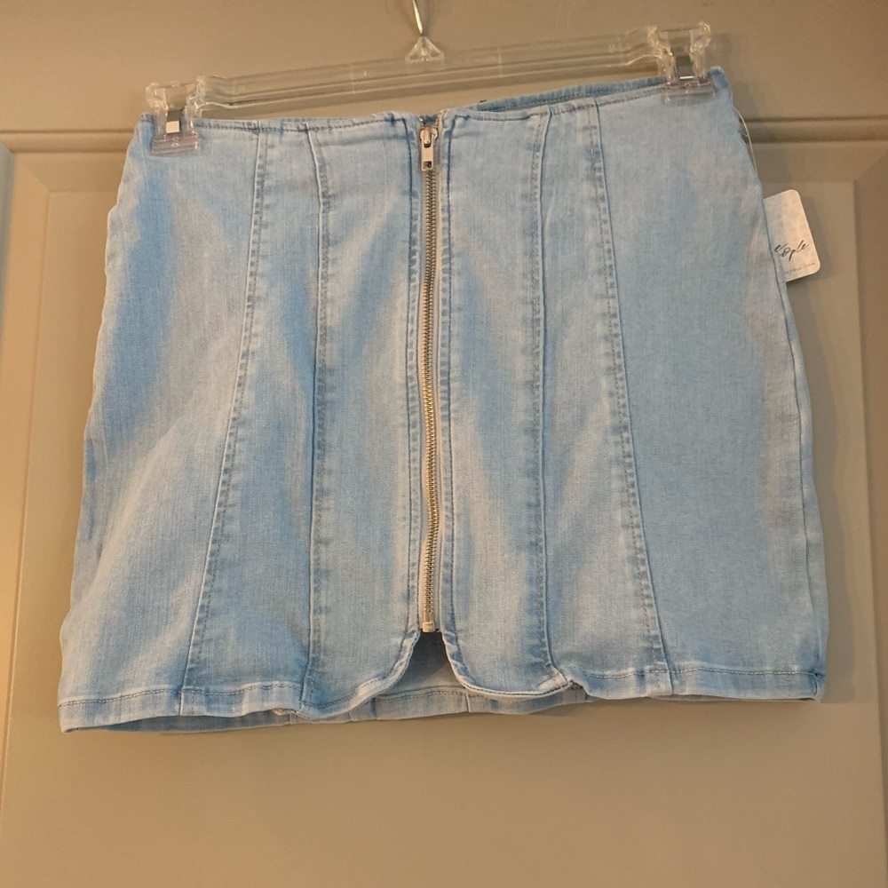 Mini light blue skirt with zipper in back.